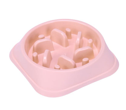 Pink pet bowl with raised design on a white background