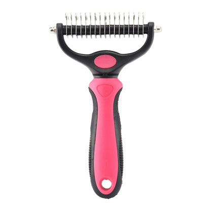 Pet grooming tool with pink handle and black body on a white background